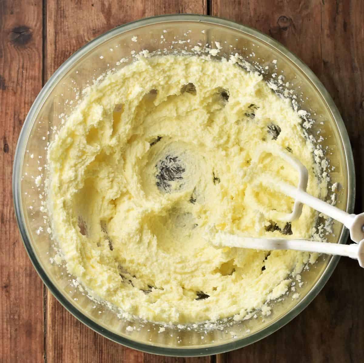 Fluffy butter mixture in large mixing bowl.