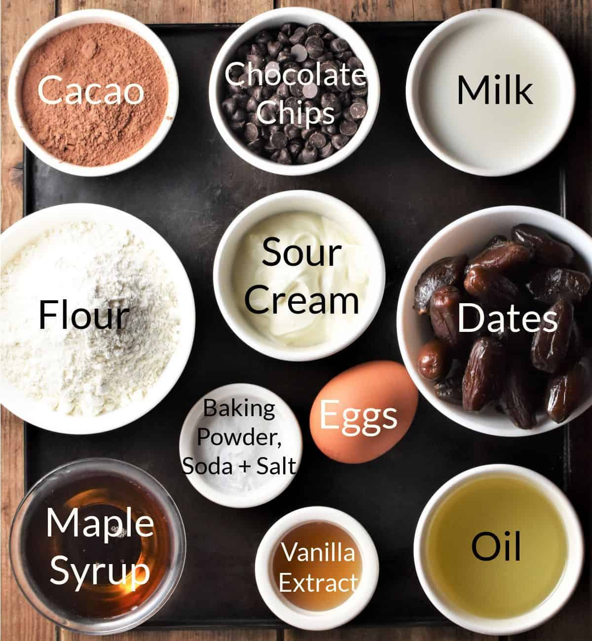 Ingredients for making healthy chocolate muffins in individual dishes.