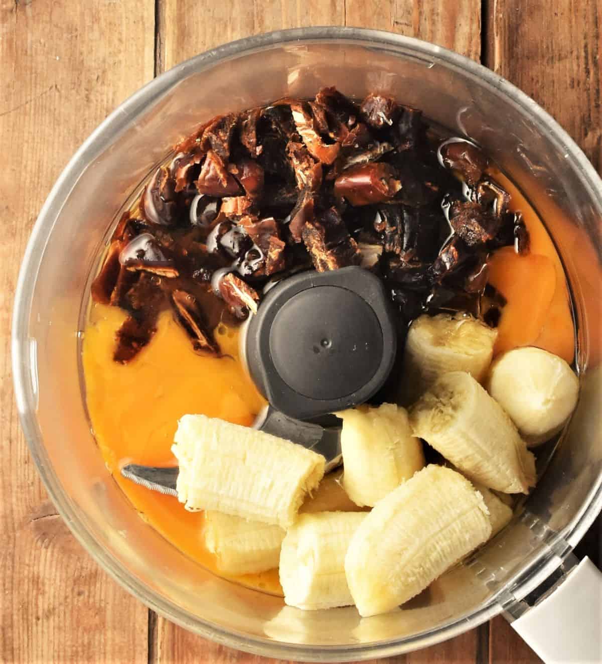 Chopped banana, dates and eggs in blender bowl.