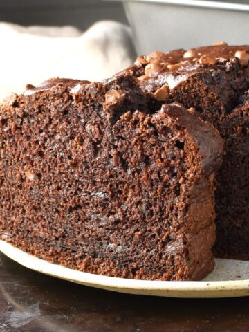 Side view of healthy chocolate banana cake on top of plate.