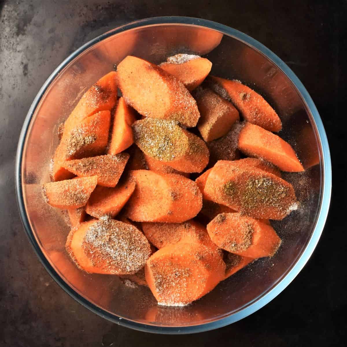 Sliced carrots with spice inside blender.