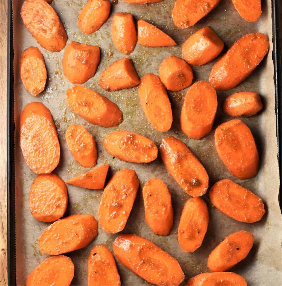 Slices of carrots on top of parchment.
