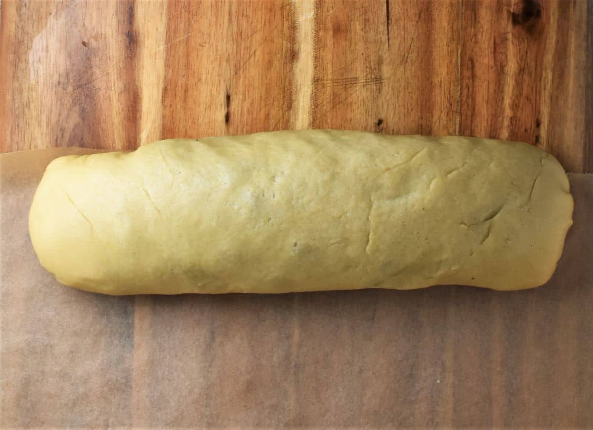 Poppy seed roll on top of parchment.