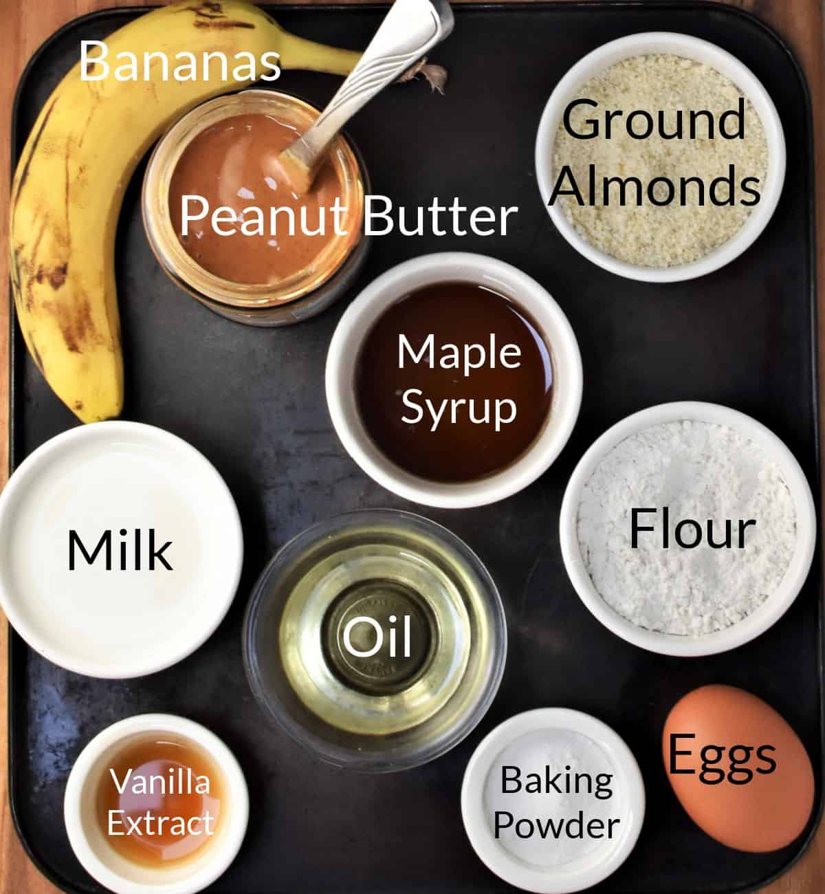 Ingredients for making peanut butter and banana muffins in individual dishes.