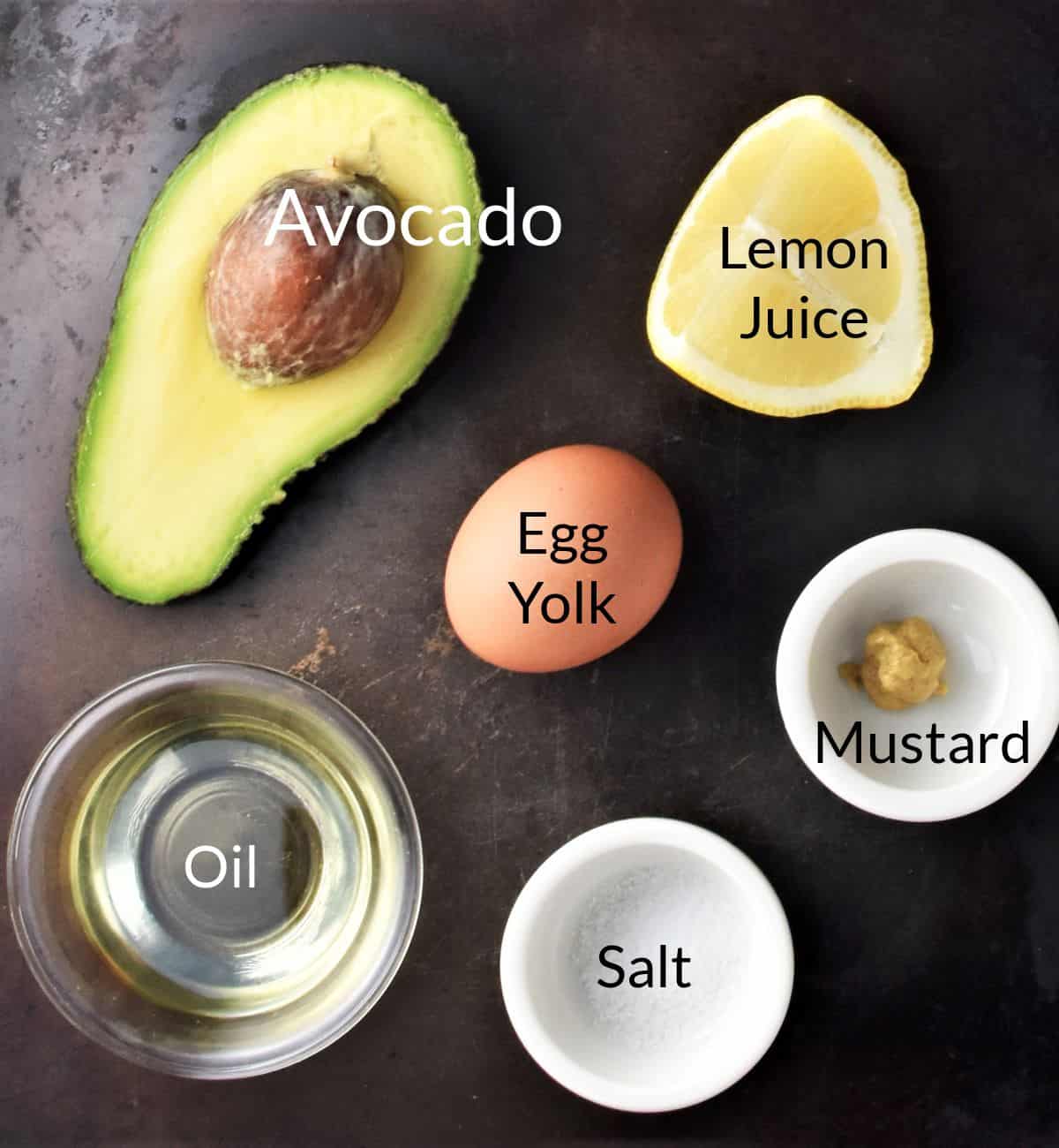 Ingredients for making avocado mayonnaise in individual dishes.