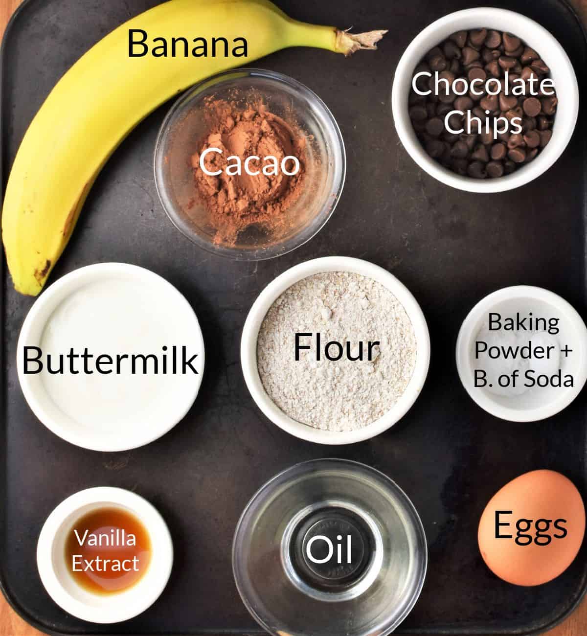 Ingredients for making banana chocolate pancakes in individual containers.