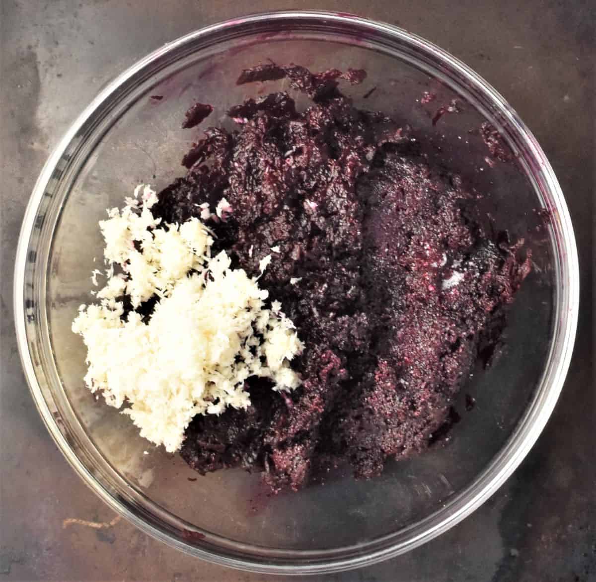 Grated beets and horseradish in mixing bowl.