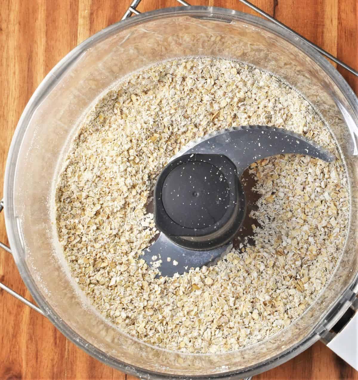 Processed oats in blender bowl.
