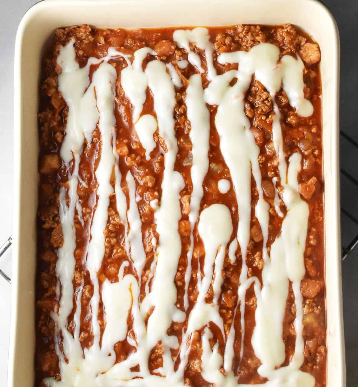 Turkey filling lasagna layer topped with bechamel.