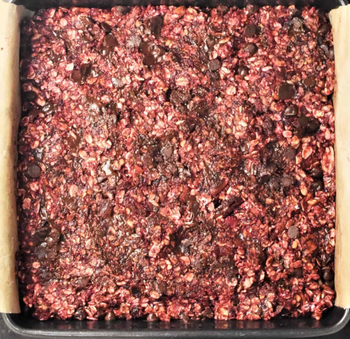 Blackberry bar mixture packed into square pan.