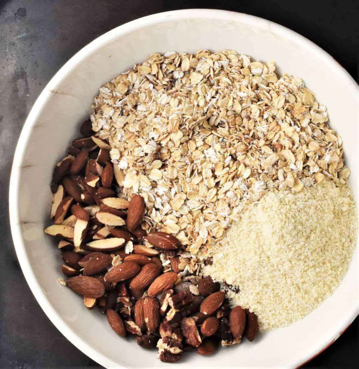 Oats, nuts and almond flour in large bowl.