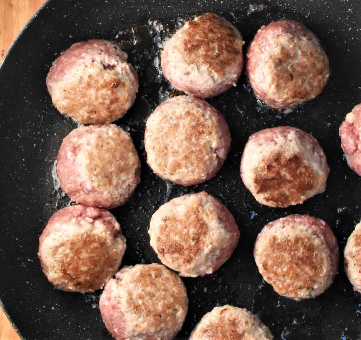 Browning meatballs in large pan.