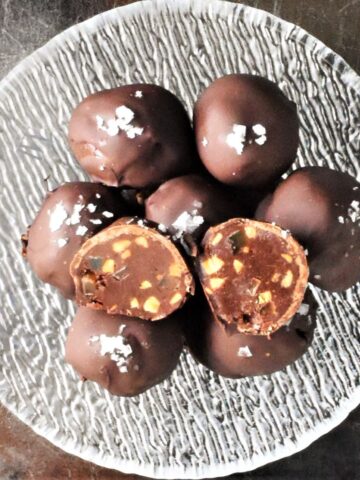 Top down view of peanut butter truffles in crystal bowl.