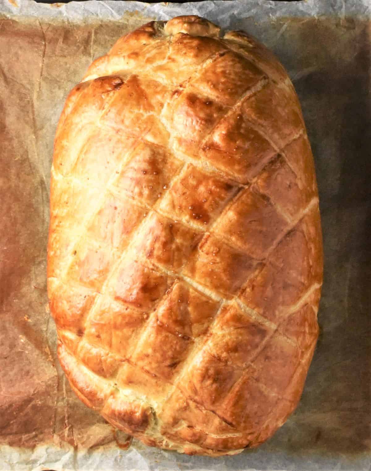 Top down view of baked turkey wellington.