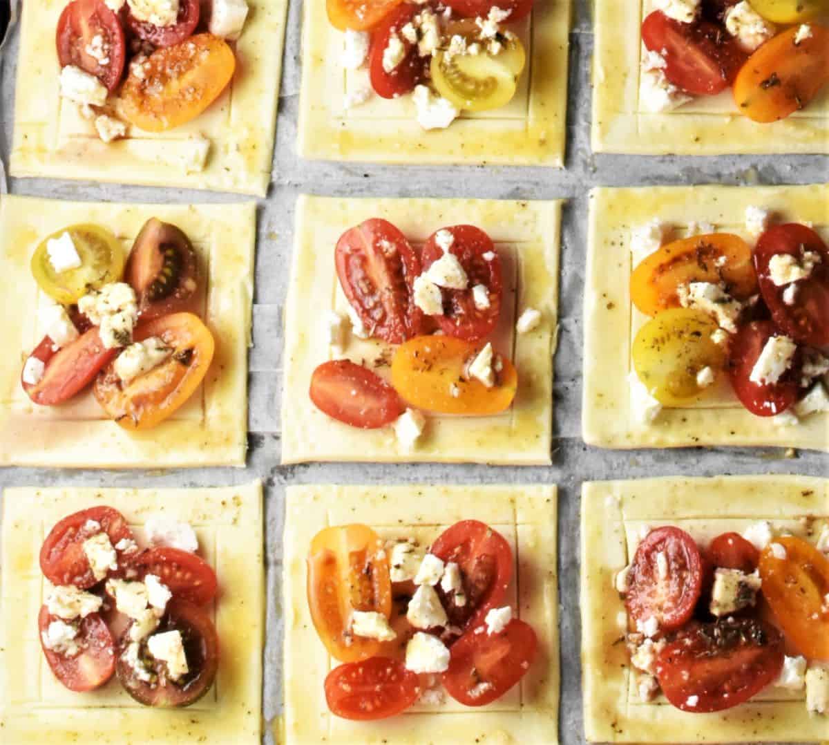 Top down view of tartlets with tomatoes and feta.