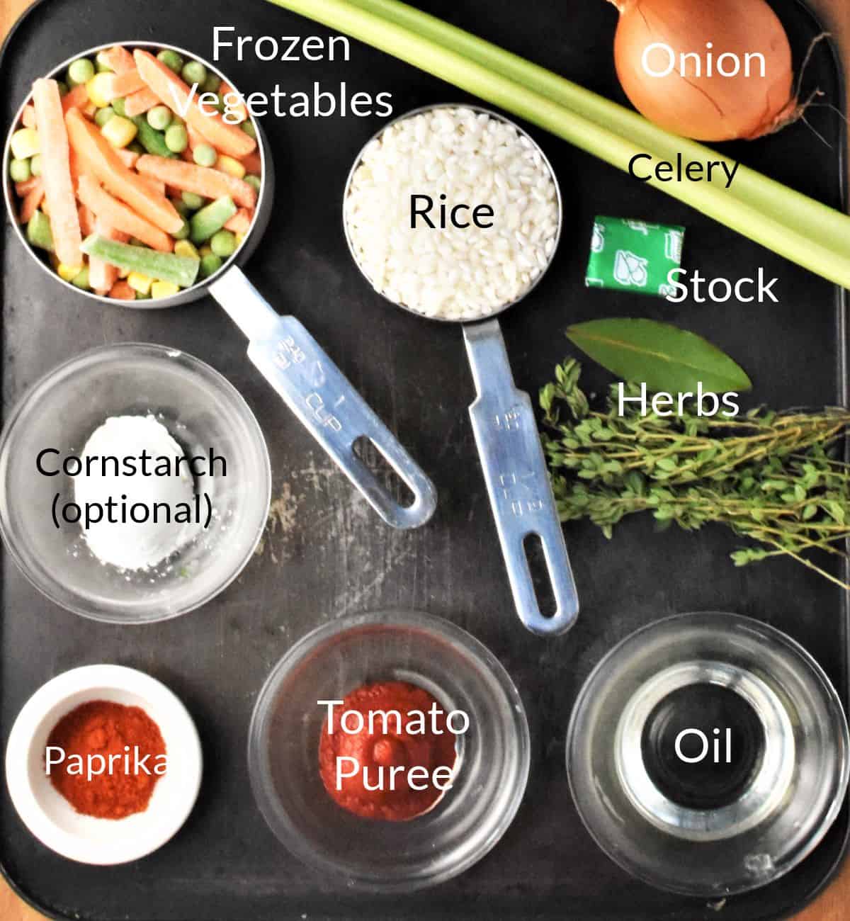 Ingredients for making vegetable rice soup in individual dishes.