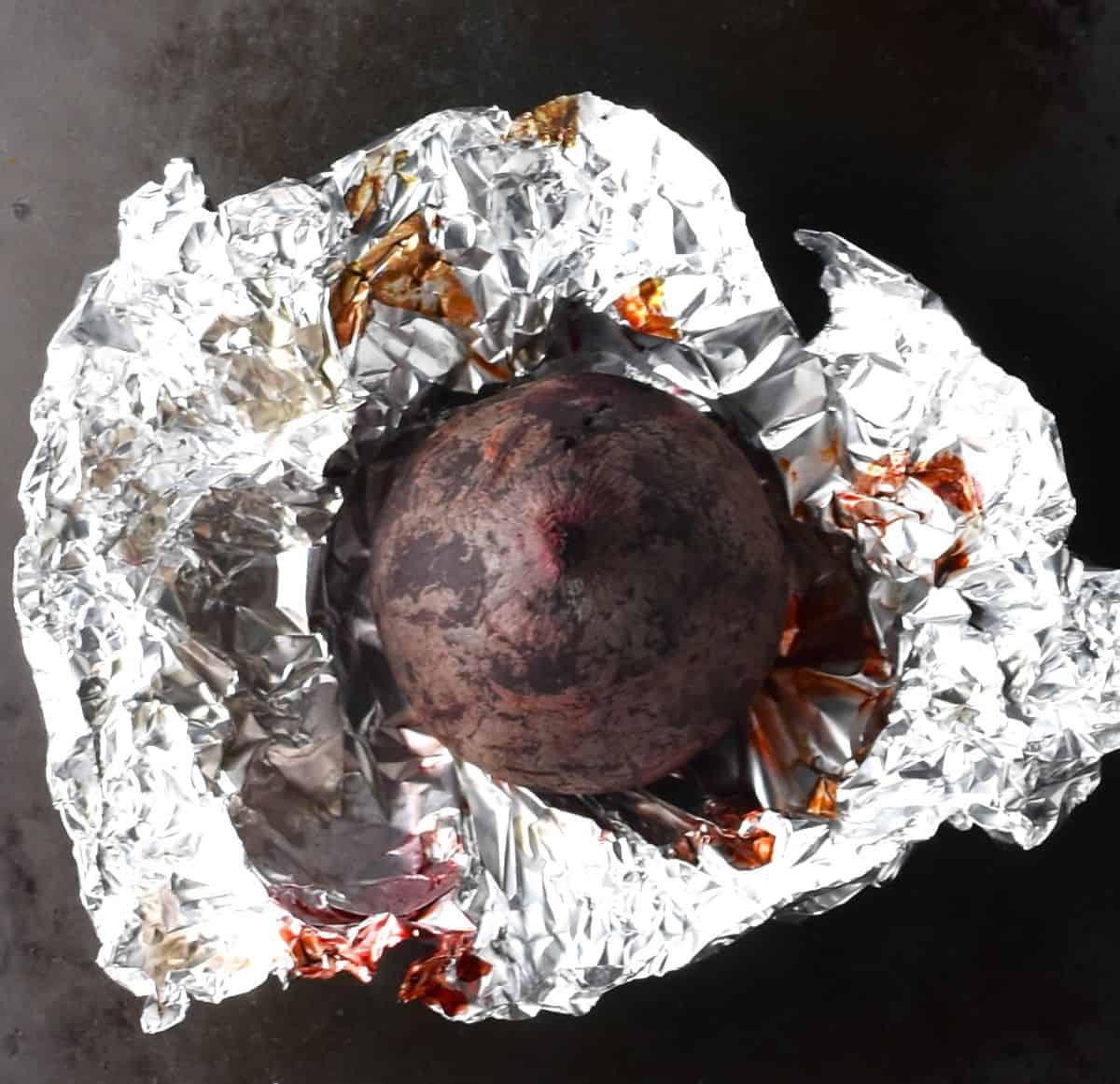 Roasted beet in tin foil.