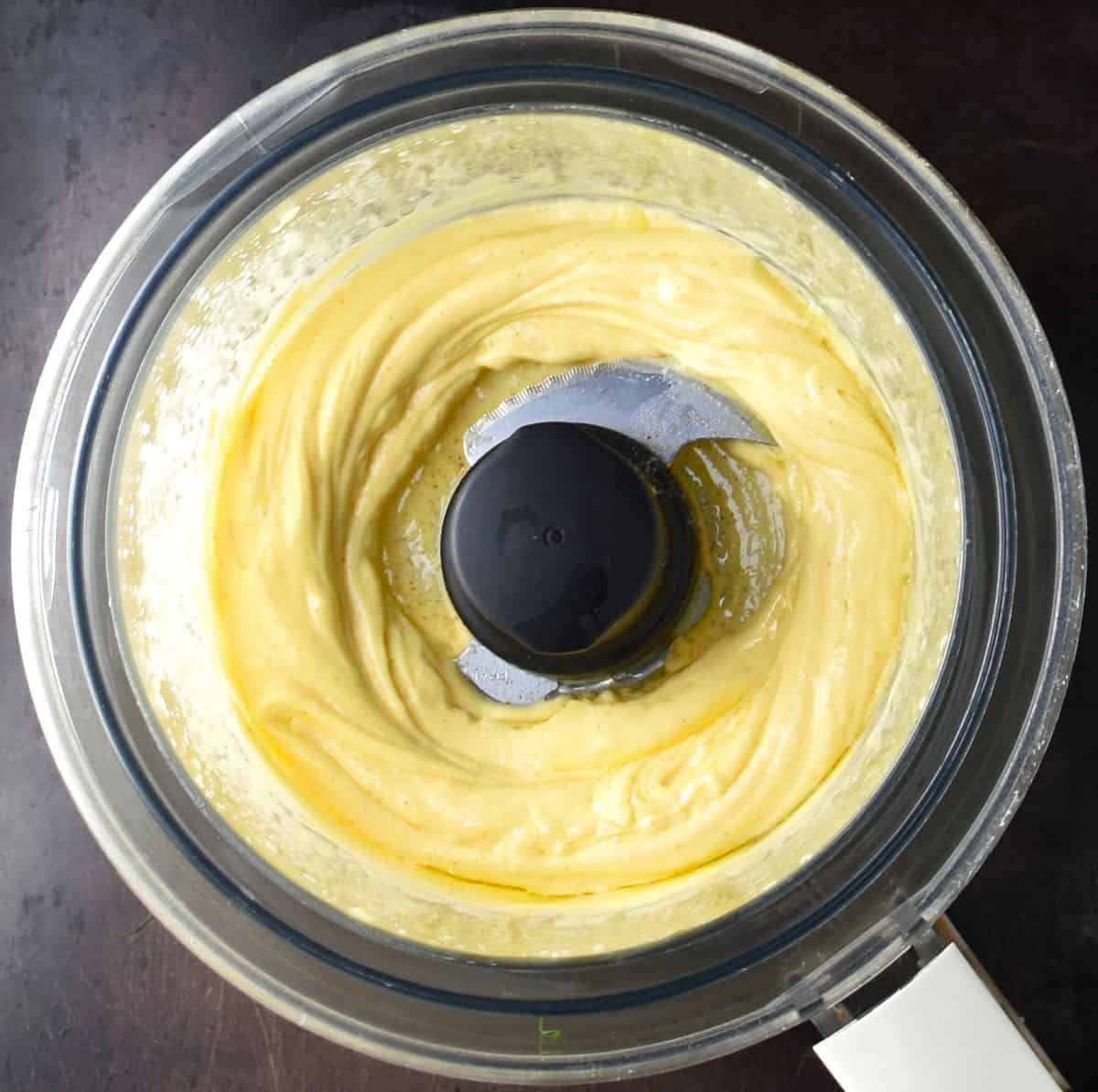 Creamy mayo base in food processor.