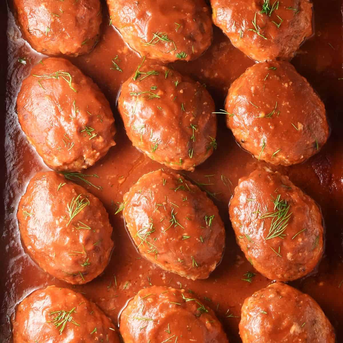 Top down view of lazy cabbage rolls in tomato sauce with dill.