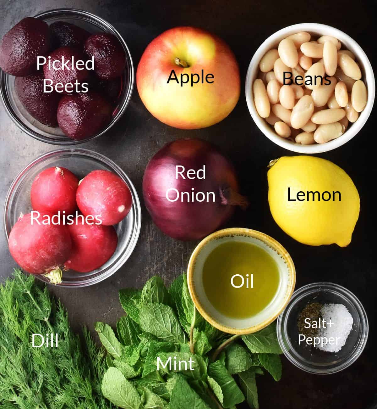 Top down view of ingredients for pickled beet salad in individual dishes.